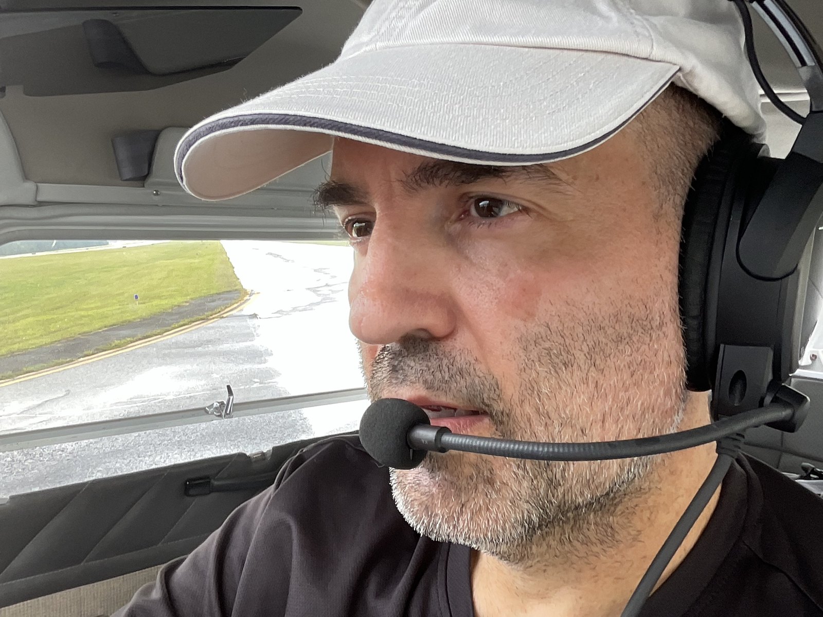 In the cockpit, wearing a headset
